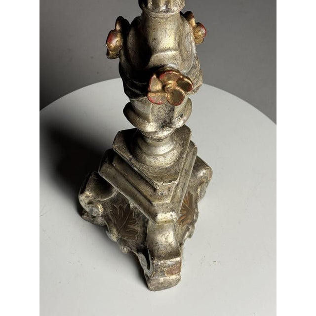 Italian candlestick. Entirely made of wood, hand-carved. Silver-plated. Originating from Italy, 18th century. Beautiful...