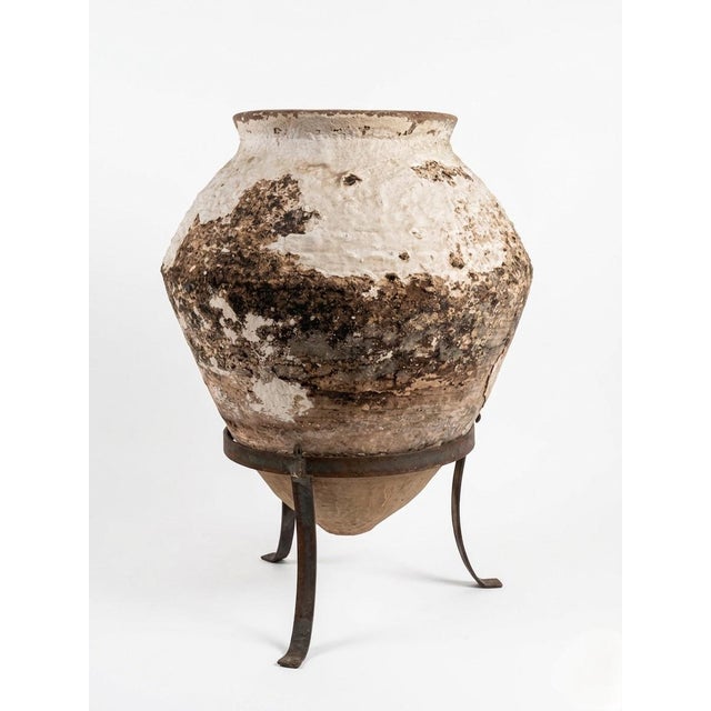 This authentic Greek olive jar, dating back to 1930, is a striking example of traditional Mediterranean utilitarian...