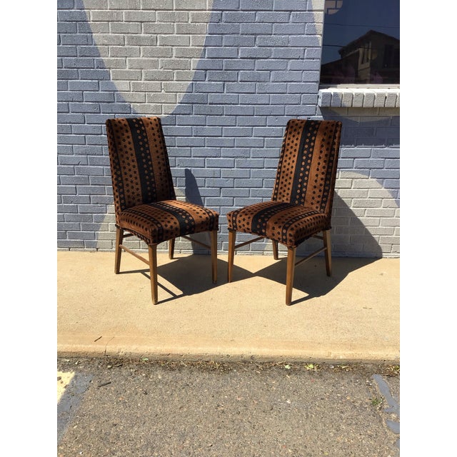 Striking pair of vintage dining chairs featuring a sleek Parsons-style silhouette, seats and backs in a bold geometric...