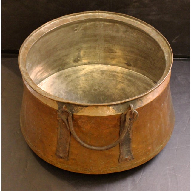 Mid-late 19th century French copper & iron swing handled cauldron pot. Dovetailed construction; worn tinned interior. Iron...
