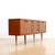 This vintage credenza was produced in Denmark during the 1960s. A classic teak cabinet with a minimalist design and sound...