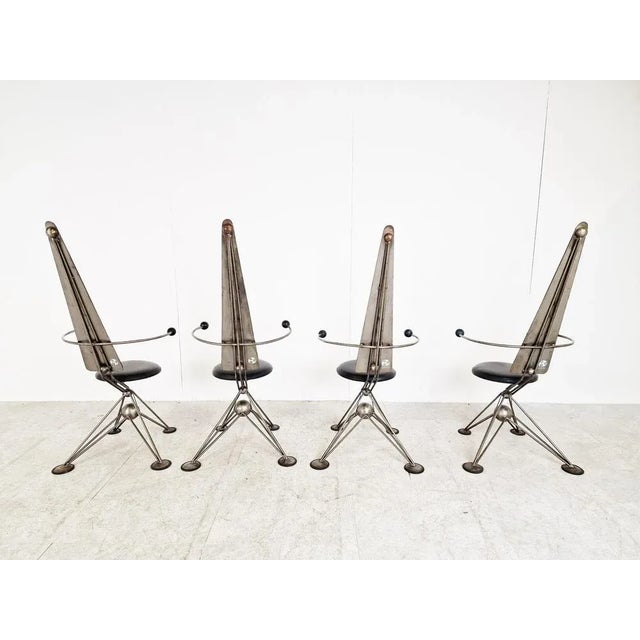Unique hand made dining chairs with space age design influence. They have a sort of 'star trek' look about them. They...