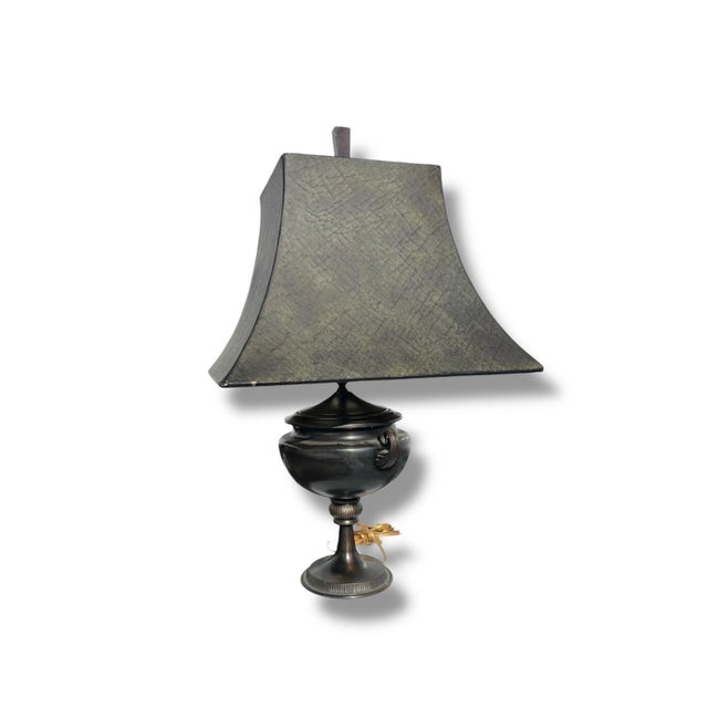 This table lamp from the 1990s features a refined neoclassical design, modeled after classical urn forms. The lamp is...