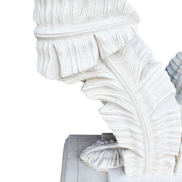 A gorgeous Hollywood Regency plaster palm leaf base dining table with oval glass top. With the faux bois base and palm...