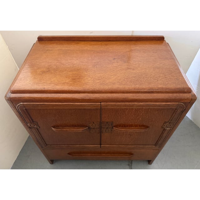 English antique oak Art Deco linen cabinet or sideboard, typically dating back to the 1930s. Pure Art Deco, characterized...