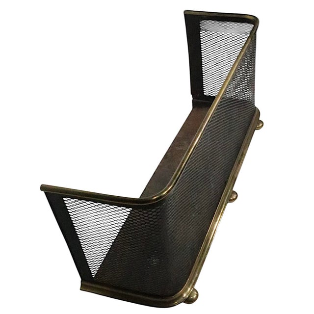 Classic antique screen front nursery style fender, having a black metal mesh front with a brass trim top, base and feet....