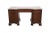 The Serpentine Front Baker Mahogany Leather Top Pedestal Writing Desk is a vintage piece with an antique brass handle...