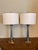 Pair of Neoclassical Brass Lamps Heavy brass Ionic Greek column lamps with laurel wreath finial and oval shades. 29” x 5”...