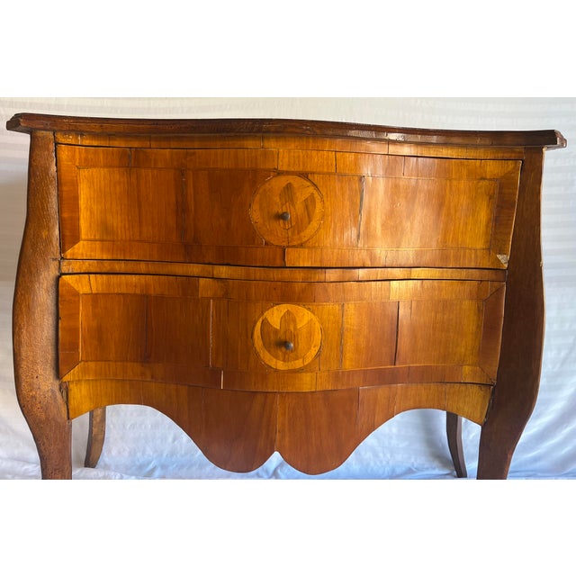Beautiful, marquetry bombe commode chest reminiscent of the 19th Century French and Louis XVI style. 2 drawer chest with...
