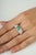 This striking ring is crafted in 925 sterling silver, featuring 0.82 carats of natural emeralds in square cuts measuring...