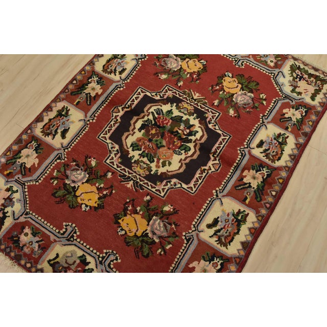 An authentic vintage traditional Bakhtiari rug hand-knotted with fine wool and natural dyes. This oriental rug features a...