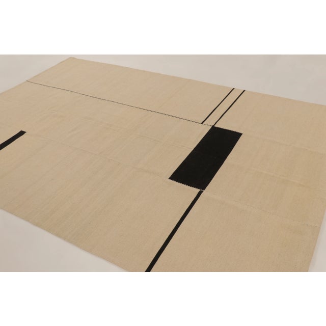 This 10x7 contemporary geometric kilim rug is a sophisticated new addition to Rug & Kilim’s curation; a masterclass in...