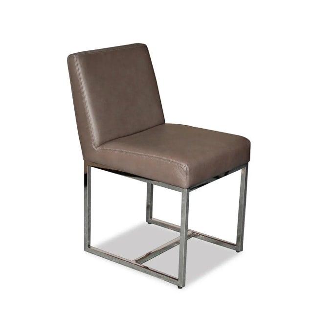 Set of 3 chairs. Simple lines mixed with a crisp and geometric silhouette, highly padded cushion and back wrapped in...