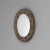 Brass framed convex mirror. Heavily patinated brass with dings in frame and minor scratches to glass. France circa 1900.
