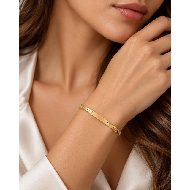 An authentic and distinctive vintage statement bracelet crafted in solid 14k yellow gold. Centering a sleek, polished...