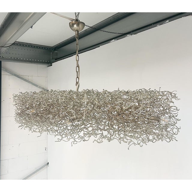 Chandelier by William Brand for Brand van Egmond, 1990s, in Good conditions. Designed 1990 to 1999 This piece has an...