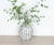 Add a touch of vintage elegance to your home with this Mid-Century Vintage Weathered White Porcelain Frilled Jar. Standing...