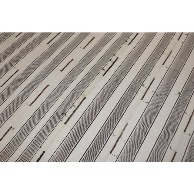 An oversize one-of-a-kind 3rd quarter of the 20th century Turkish Kilim in gray, ivory and brown Measures: 11'4'' x 17'.
