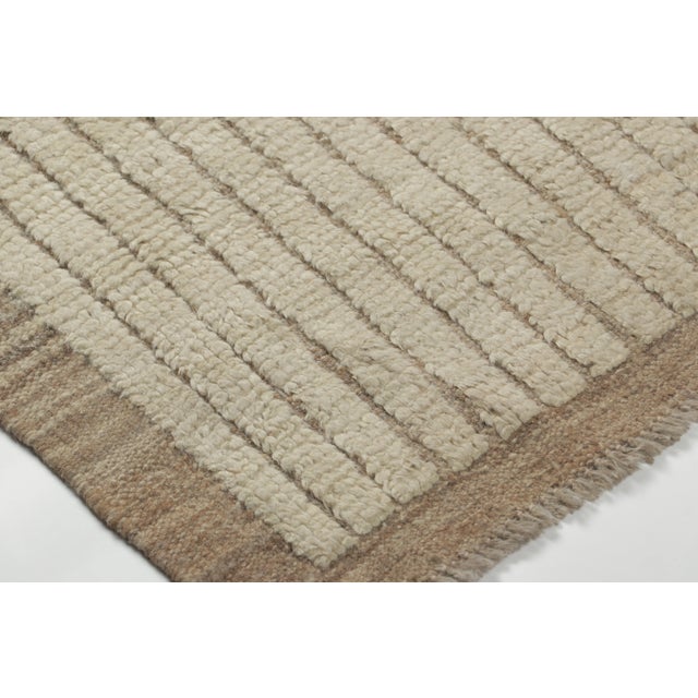 Hand-knotted in wool as a modern creation, this 2x3 contemporary striped gift-sized rug joins Rug & Kilim’s Modern...