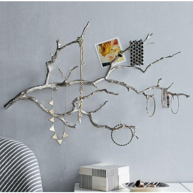 Hang earrings, necklaces and bracelets from the silver branches of this West Elm Manzanita Wall Jewelry Branch. There are...