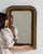 A classic Louis Philippe mirror characterized by its rounded corners and simple, elegant frame. The restrained design...
