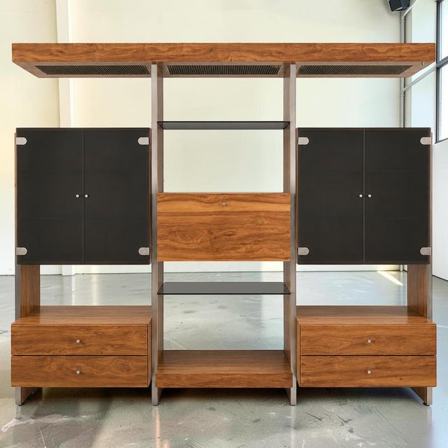 Stunning Mid-Century Modern chrome, smoked glass, and faux wood wall unit in the manor of John Stuart. This is an...