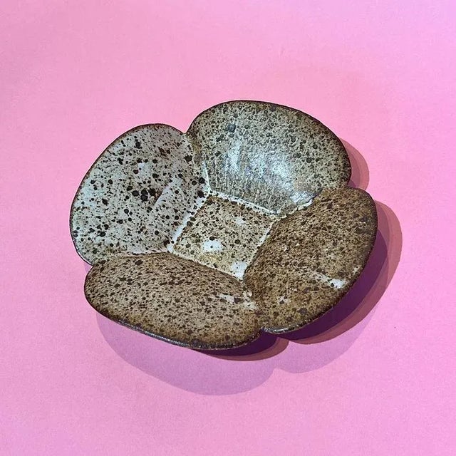 Visual Description: This decorative catchall trinket dish measures approximately 8 inches in width on one side, 6 inches...