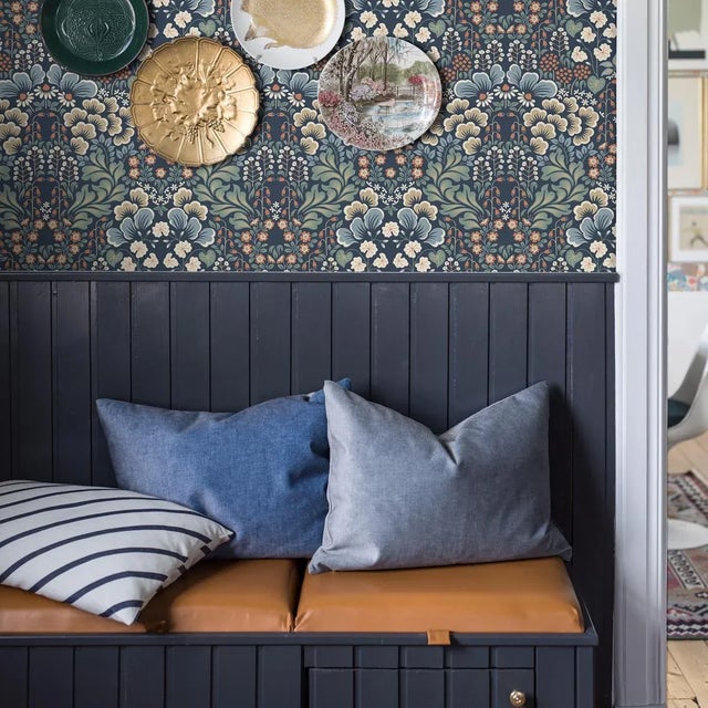 A stylized depiction of a Swedish meadow in bloom, Boråstapeter’s Blomstervall wallpaper is a surface-printed design that...