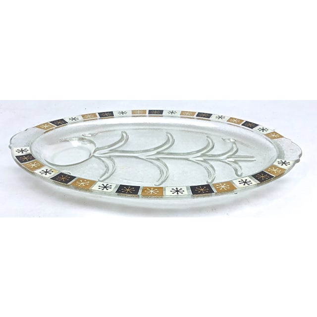 Vintage, circa 1910-1960. This Mid Century Modern glass roast serving platters features stunning, stationary ridges....