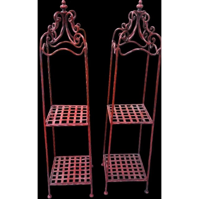 A beautiful pair of red iron decorative free standing shelving units. The shelving units are in their natural bright...