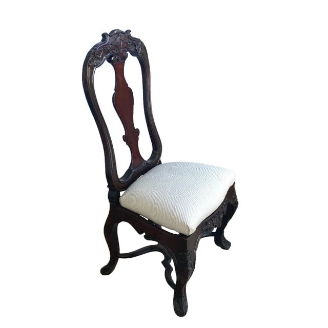 A fine and rare pair of Eighteenth Century Portuguese walnut slipper chairs. Each with shaped crest scarves with shells...