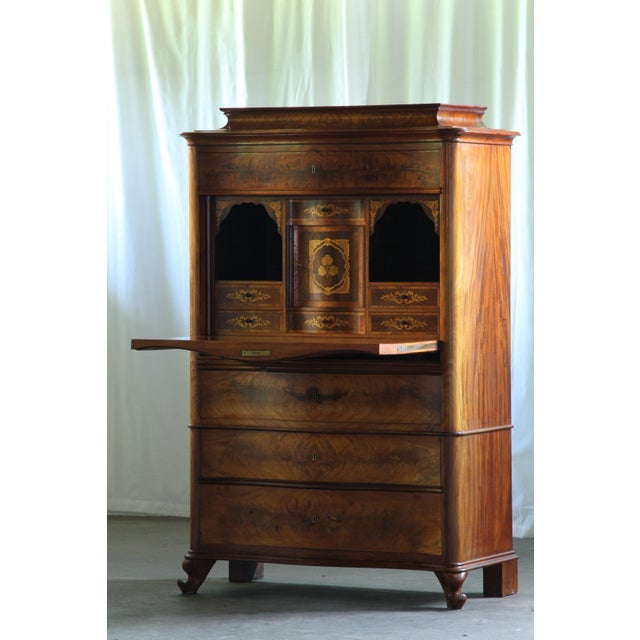 This 19th-century secretary desk, also known as an escritoire, is a stunning piece crafted from exquisite burr veneer with...