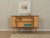 A wonderful corner cabinet from the 1950s with an integrated bar compartment. High-quality body in walnut/ash veneer with...