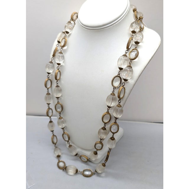 1970s goldtone alternating oval clear melon beads with bezel set oval discoball-like faceted beads sautoir necklace with...