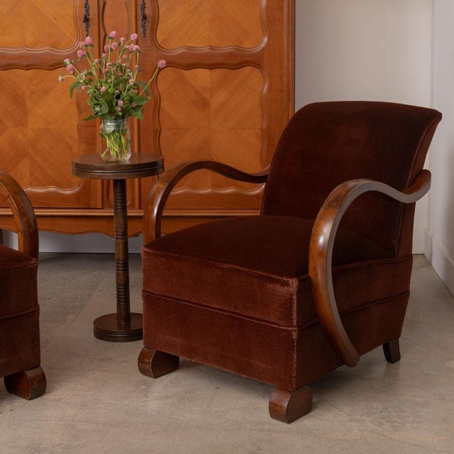 Incredible pair of Art Deco armchairs from France, 1930s. Sculptural frame with beautifully curved wood arms and rounded...