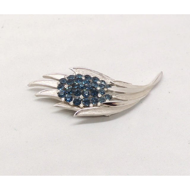 This is part of Chairish’s Costume Jewelry assortment. 1960s rhodium plated round faux-sapphires with small clear round...