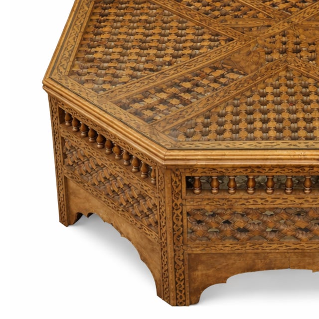 An exceptional vintage Moroccan octagonal coffee table. The surfaces are openwork with repeating turned components on the...
