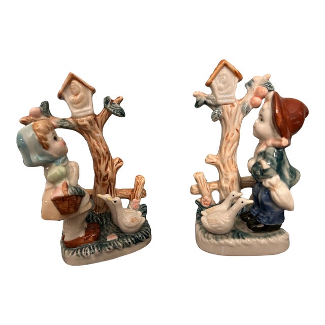 Lot of Two Vintage Porcelain Figurines Boy and Girl With Trees and Birdhouses For Sale