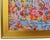 Abstract, impressionistic canvas painting of a field of red and orange poppy flowers, with soft vertical brushstrokes in...