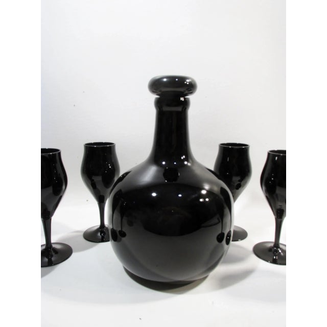 Striking vintage modernist 1970s era all black glass crystal decanter and goblets set. Believe this was made by Towne...