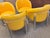 Four Fabulous retro club chairs, yellow vinyl with white piping and chrome tube legs on matching chrome casters in great...
