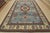 A tribal Caucasian Kazak rug hand-knotted with fine wool on a cotton foundation. This oriental rug features a central...