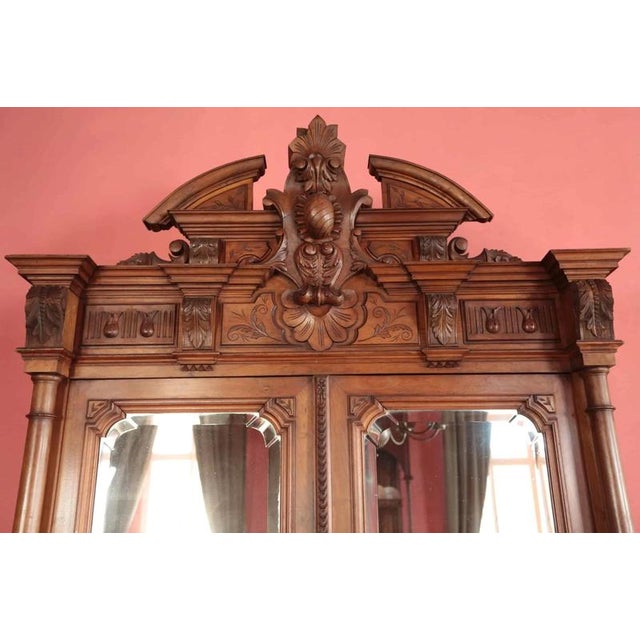 Quality and masterful craftsmanship are visible at first glance. The richly decorated wardrobe in a two-door design with a...
