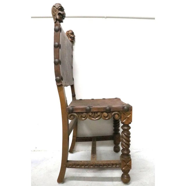 This set of antique 6 Gothic Revival wooden and leather chairs by the brand Revival is a stunning addition to any home....