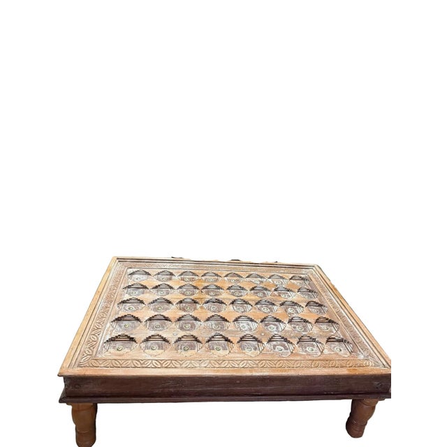 Bring home timeless character with this antique carved chai coffee table, finished in a soft rustic whitewash that...