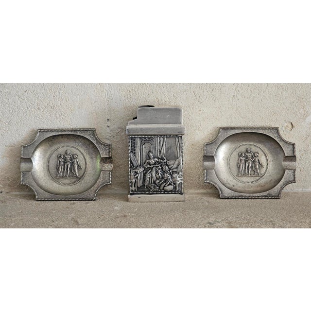 Step back into the elegance of the 1920s with this rare French Art Deco brass ashtray set, complete with its original...