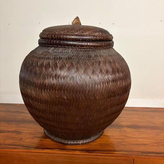 Beautiful large-scale vintage handwoven basket with fitted lid, likely Southeast Asian. This is a striking, sculptural...