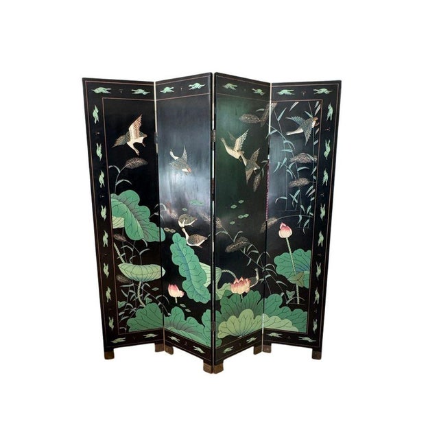 A striking example of classic chinoiserie, this vintage Chinese four-panel folding screen features a serene pond landscape...