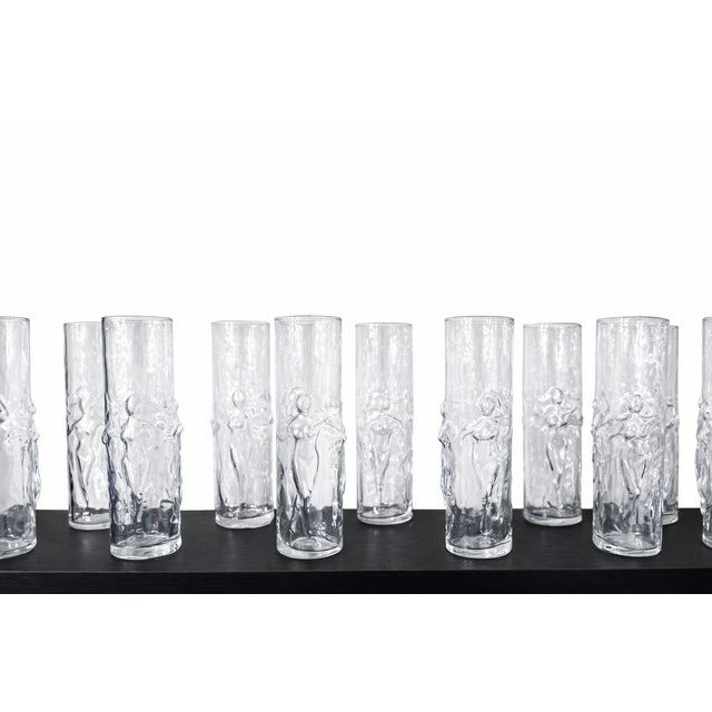 A striking and iconic set of twelve vintage Libbey “La Femme” highball glasses, featuring the sculptural raised female...