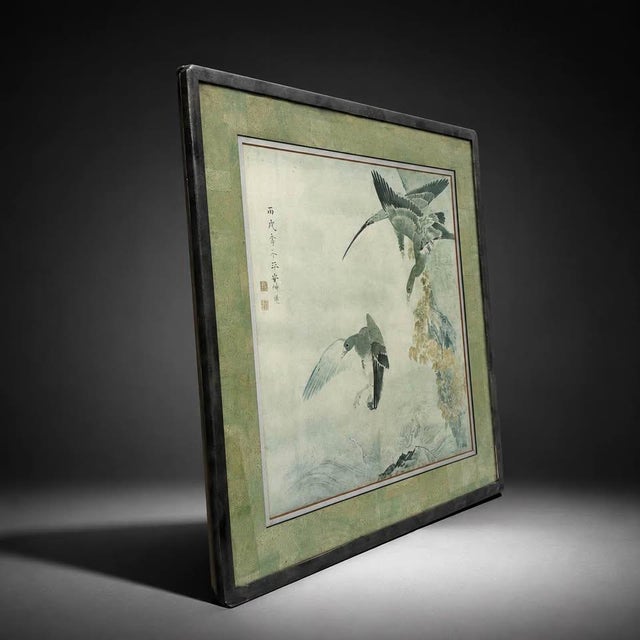 Elegant framed painting on paper in a traditional East Asian ink and wash style. The artwork depicts birds in flight over...